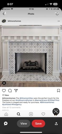 the fireplace is decorated with white and black tiles