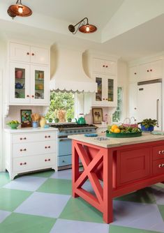 a kitchen with green and white checkered flooring, an island in the middle