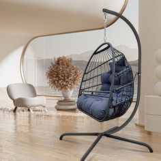 a chair that is sitting in the middle of a room with a swing on it