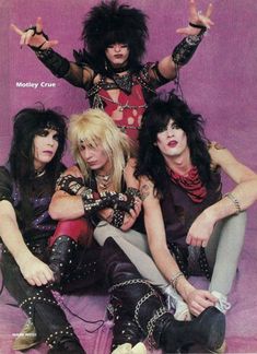 the band kiss posing for a magazine cover