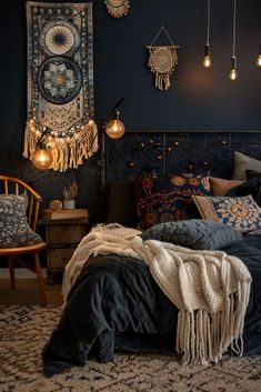 a bedroom with dark blue walls and hanging lights