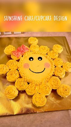 a sunflower cake with yellow frosting sitting on top of a gold foil bag