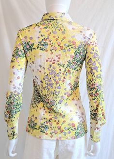 Circa 1970s Charming floral print blouse by Loubella Extendables Pretty soft color palette: pale yellow, lavendar, white, pink and green Button front Large winged collar Made of a nice, drapey polyester Bust 34 Waist 30 Hips 34 Sleeves 23 inch Shoulder seam to seam 15 inch Length from shoulder to hem 24 inch Excellent condition. I see no flaws. Best fit extra small to small Please message me if you have any questions or need additional pictures. Thanks for looking! Fall Yellow Shirt With Floral Print, Feminine Fitted Yellow Blouse, Fitted Yellow Printed Shirt, Yellow Printed Collared Blouse, Fitted Yellow Printed Blouse, Fitted Long Sleeve Yellow Blouse, Spring Vintage Print Button-up Blouse, Spring Button-up Top With Vintage Print, Spring Vintage Print Button-up Top