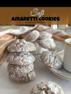 powdered sugar cookies stacked on top of each other next to a cup of coffee