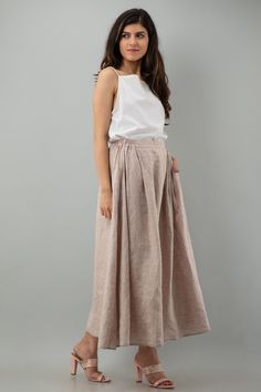 Details Soft linen Maxi Skirt length 36" | 91 cm Elasticated Back Waist Skirt with Side Pockets Detailed with folds in front to provide more flare and decent look Finished with French seam ★★ Very Comfortable Eco-Friendly Natural Fabric It is Medium weight OEKO TEX 100 certified. Model is wearing S size Skirt, her body measurements are Height: 5'6"/167 cm Bust: 32"/ 81 cm Waist: 28"/ 66 cm Hip: 36"/ 91 cm For size Guide Select our more colors and size (XS, 2XL) of your choice from the given colo Spring Linen Pleated Bottoms, Spring Pleated Linen Bottoms, Spring Linen Skirted Bottoms, Spring Linen Flared Skirt, Linen Flared Skirt For Spring, Beige Linen Gathered Skirt, Flowy Linen Pleated Skirt, Linen Pleated Long Skirt, Long Linen Pleated Skirt