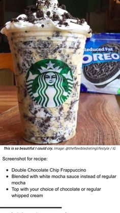 a cup of coffee with whipped cream and oreo cookies on top