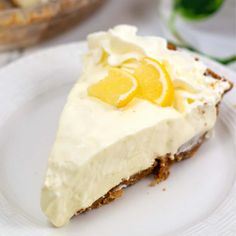 a slice of lemon pie on a white plate