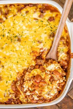 a casserole dish filled with cheese and meat