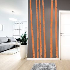 an orange and gray wall in a living room