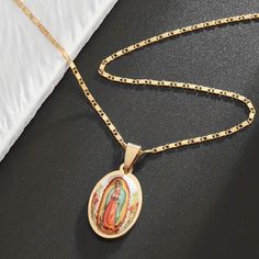 This vintage golden pendant necklace features an oval-shaped design with an image of the Virgin Mary. It is a handcrafted piece made with multi-stone materials and stainless steel metal. The necklace has a length of 17 inches and is designed for unisex adults. The pendant necklace is a perfect gift for religious believers. It is a beautiful and unique piece of handcrafted artisan jewelry that can be worn on any occasion. The necklace has a religious theme and a charming style that makes it suitable for both men and women. It is a must-have accessory that will enhance any outfit and add a touch of elegance to your look. Applicable Age Group: Over 15 Years Old Main Material: Zinc AlloyMosaic Pendant: .71 x 1.38inch Necklace: 17 inch Our Lady Of Fatima Necklace Vintage, Oval Our Lady Of Guadalupe Necklace For Gift, Oval Our Lady Of Guadalupe Necklace Gift, Oval Our Lady Of Guadalupe Jewelry Gift, Spiritual Oval Necklace Featuring Our Lady Of Guadalupe, Spiritual Oval Our Lady Of Guadalupe Necklace, Golden Pendant, Mary Necklace, Virgin Mary Necklace