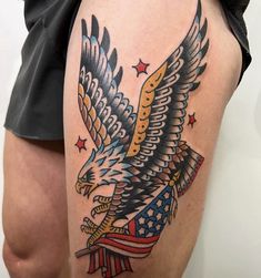 an eagle with the american flag on it's thigh