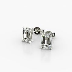 14K White Gold Emerald Cut Lab-Grown Diamond Stud Earrings (1.00 CTW - F-G / VS2-SI1). This pair of classic pear shape diamond earrings feature a tapered basket, showcasing the unique characteristics and striking outline of a pear shape diamond. Splinters of light shimmer and shine with every move. Emerald Cut Diamond Earrings, Emerald Cut Stud Earrings, Jewelry Photoshoot, Emerald Cut Diamond, Unique Characteristics, Funky Jewelry, Diamond Stud Earrings, Fine Jewelry Designers, Pear Shaped Diamond