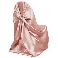 the back of a chair covered in a pink satin fabric with a bow on it