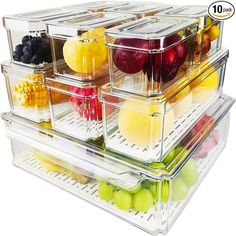 four clear containers filled with different types of fruits and veggies on top of each other