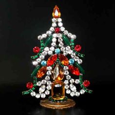 a small christmas tree with multicolored jewels