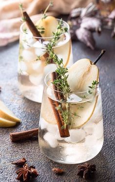 two glasses filled with ice and apple slices