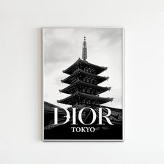 a black and white photo with the words dior tokyo in front of a pagoda