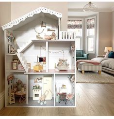 a doll house with furniture and accessories in it