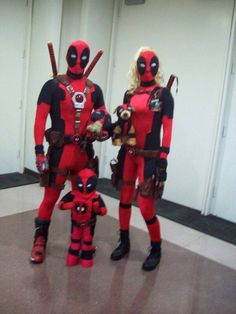 two people in deadpool costumes standing next to each other