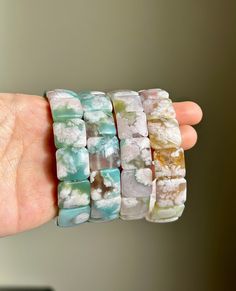 FREE SHIPPING to the US when you spend $35+ at my shop! FREE Eco-friendly gift wrapping service available!  Size: 15x15mm Material:   Flower Agate Elevate your energy and style with my handcrafted gemstone bracelet! Feel free to check out more flower agates here in my store: https://www.etsy.com/shop/MuseAndGems?ref=dashboard-header&section_id=46669605 You will receive the product as shown in the picture. These bracelets are suitable for wrist sizes ranging from 5.5-6.5 inches (14-16 cm). Please inform me your wrist size after purchasing, and I will adjust the beads accordingly to fit your size.  Note: Sizes are actual wrist circumference, not the length of the bracelet. So, please MEASURE YOUR WRIST. Please Read: I strive to provide you with high-quality, affordable jewelry. Each piece is Eco Friendly Gift Wrapping, Sakura Flower, Flower Agate, Bracelet Gemstone, Agate Bracelet, Gift Wrapping Services, Affordable Jewelry, Eco Friendly Gifts, Different Light