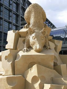 a statue of a bear on top of a building