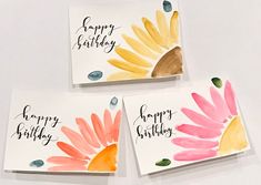 three cards with watercolor flowers on them and the words happy birthday written in black ink