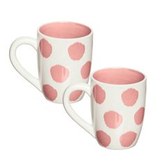 two coffee mugs with pink polka dots on them