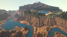 an aerial view of a mountain and river