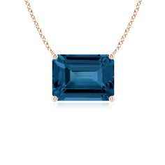 Featuring a contemporary design, this 14k rose gold east-west pendant looks captivating. The emerald cut London blue topaz is horizontally mounted in a prong setting. Blue Topaz Pendant Necklace, 4th Wedding Anniversary, Solitaire Pendant, Yellow Gold Chain, East West, London Blue Topaz, London Blue, Fine Jewellery Necklace, Emerald Cut