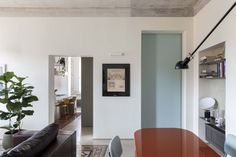 a living room filled with furniture and a wooden table