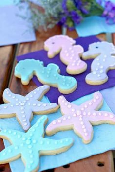 some decorated cookies are sitting on a table