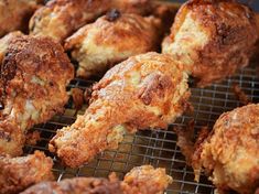 some fried food is cooking on a wire rack and it looks like they have been cooked