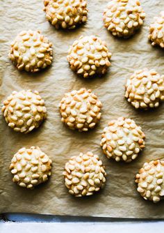 twelve cookies are arranged on a baking sheet and ready to be baked in the oven