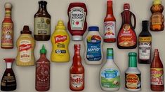 an assortment of condiments are displayed on a refrigerator door display case, including ketchup, mayonnaise and dressing