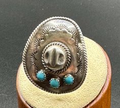 Order now to receive your jewelry in time for Valentine's Day! This cool sterling silver cowboy hat ring is highly detailed and sits beautifully on the hand. This silver ring is crowned with 3 blue turquoise stone and the shank as well as the brim of the hat feature twist wire detail. The size of this piece makes it the perfect size for teenagers, as well as women.  It also pairs beautifully with other turquoise and silver jewelry.   Handmade jewelry makes wonderful gifts. This silver ring would Cowboy Hat Ring, Silver Cowboy Hat, Horse Ring, Cowgirl Gifts, Silver Turquoise Jewelry, Rings Handmade, Silver Jewelry Handmade, Thumb Rings, Silver Rings Handmade