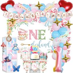 a pink and blue 1st birthday party with balloons, streamers, confetti and decorations