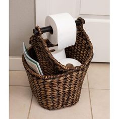 a wicker basket with two rolls of toilet paper in it