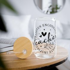 a glass jar sitting on top of a wooden table