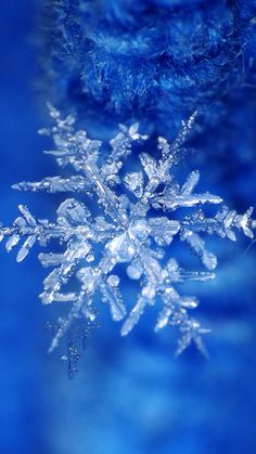 a snowflake is shown against a blue background