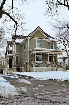 a house with snow on the ground and trees