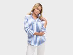 BLUE SATIN & WHITE STRIPE Our menswear inspired Weekend Shirt in a classic blue and white satin stripe. Spring Workwear Top With Signature Stripes, Blue Relaxed Fit Top With Striped Cuffs, Blue Tops With Striped Cuffs In Relaxed Fit, Blue Relaxed Fit Tops With Striped Cuffs, Elegant Striped Relaxed Fit Tops, Blue Tops With Striped Cuffs Relaxed Fit, Blue Tops With Striped Cuffs And Relaxed Fit, Spring Top With Striped Spread Collar, Spring Blouse With Striped Spread Collar