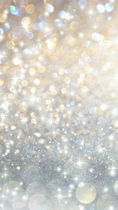 an abstract background with sparkling lights and stars