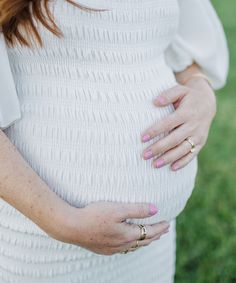 Our best-selling maternity dress for a trendsetting #momtobe. Features a luxurious smocked body, lantern-style sleeves (worn on or off-the-shoulder), bodycon fit, and below-the-knee-length with ruffle details. Wear during and after pregnancy! Available in colors White, Mauve, Light Blue and Siren Red. Maternity & Postpartum wear 100% Polyester Fully Lined Size Chart. For a bodycon fit, size down, for a loose fit, size up. Questions? Need two sizes? Chat with a stylist using the chat icon! Fitted Maternity Dress With Smocked Back, White Bump Friendly Maternity Dress, White Bump-friendly Maternity Dress, Bump Friendly White Maternity Dress, Spring White Bump Friendly Dress, Spring White Bump-friendly Dress, Maternity Stores, Chat Icon, Pre Pregnancy