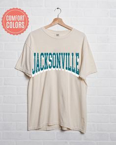 "comfort colors Jacksonville Football shirt, Jacksonville Football Shirt, Retro Jacksonville Football Shirt, Jacksonville Football Gift -Please check Color and Size Charts before placing the order. You can find them in the listing's photos (Depending on what device you are viewing this listing colors may vary slightly). -Returns and exchanges are accepted only if there are defects \"No Extra Costs\" We create custom t-shirts with great designs for everyone's liking. If you don't find the size or color you would like, please message us and we will be happy to  accommodate! comfort colors Jacksonville Football shirt, Jacksonville Football Shirt, Retro Jacksonville Football Shirt, Jacksonville Football Gift PRODUCT T-shirt Comfort Colors® 1717     Medium fabric (6.1 oz/yd² (206.8 g/m     Rela Relaxed Fit Cotton Shirt For College, Casual Cotton Shirt For College, White Cotton Camp Shirt With Crew Neck, White Cotton Crew Neck Camp Shirt, Cotton Graphic Tee Camp Shirt With Letter Print, Cotton Camp Shirt With Letter Print, Football Gift, Football Gifts, Gift Product