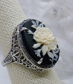 <> Design #230 Custom/Made to Order This is a brand new stunning Art Nouveau/Vintage designed sterling silver filigree cameo ring. Choose from a variety of colors and themes. The stunning oval resin cameos are 18mm (just shy of 3/4th of an inch) by 13mm (1/2 inch) in dimension... This ring is 21mm NS on the finger. The inside of the band is marked 925 for sterling. Notice the beautiful filigree swirl like the craftsmanship of the silver setting. This lovely ring stands out and illuminates Lady Silhouette, Flower Lady, Art Deco Flower, Blue Aquamarine Ring, Antique Filigree, London Blue Topaz Ring, Cameo Ring, Psychobilly, Sterling Silver Filigree