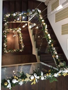 the stairs are decorated with garlands and ornaments