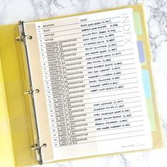 a yellow binder sitting on top of a table