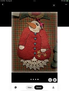 an image of a snowman in a red coat and white lace skirt on the instagram page