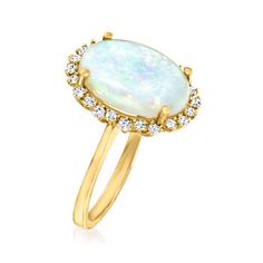 Ross-Simons - Opal and .30 ct. t. w. Diamond Ring Oval Cut in 14kt Yellow Gold. Size 6. Captivating and iridescent, this 14x10mm oval opal cabochon ring has the ability to amaze. Glittery .30 ct. t. w. round brilliant-cut diamonds gracefully trace around its perimeter, completing the radiant design. Crafted in 14kt yellow gold. 5/8" wide. Diamond and opal ring. Opal birthstones are the perfect gift for October birthdays. Diamond Ring Oval, October Birthdays, Opal And Diamond Ring, Opal Birthstone, Ring Opal, Opal Color, Natural Gold, Cabochon Ring, Ring Oval