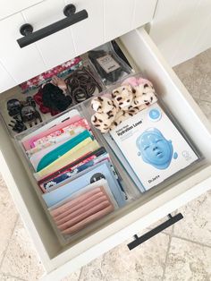 an organized drawer with various items in it